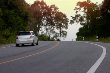 Obraz premium Blurred car trip travel asphalt road on mountain at Hills Banchang Rayong Thailand. 