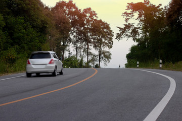 Fototapeta na wymiar Blurred car trip travel asphalt road on mountain at Hills Banchang Rayong Thailand. 