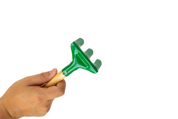 hand holding pitchfork garden tool close up isolated on white background with clipping path.