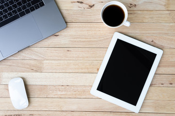 Business office table with laptop, smartphone, cup of coffee and supplies. on wooden background. Top view with copy space, flat lay.