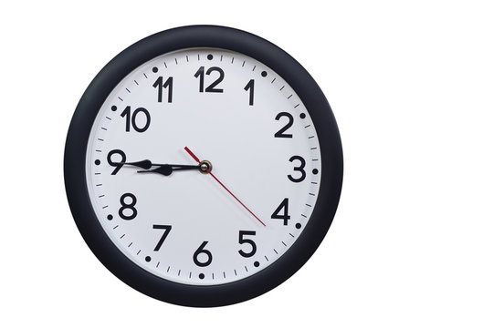 Time concept with black clock at a quarter to nine