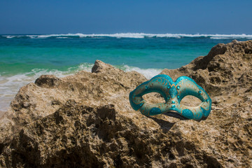 Fototapeta na wymiar masquerade party mask on beach view