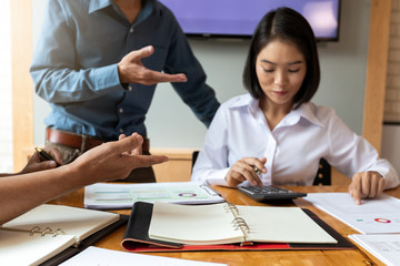 Fototapeta premium Business team meeting and discussing project plan. Businessmen discussing together in meeting room. Professional investor working with business project together. Finance managers task.