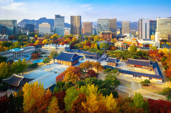 Autumn park and temple in old palace in Seoul city