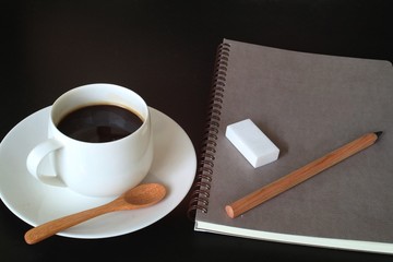 A cup of coffee on working table.