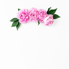 Floral frame with pink rose flowers and leaves white background. Flat lay, Top view. Flowers texture.