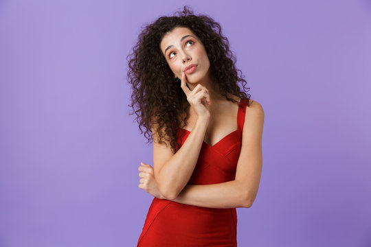 Portrait of a pensive woman with dark curly hair