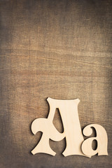 wooden letters at old background