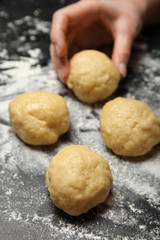 Fototapeta na wymiar Woman hands in flour make dough. Knead bakery, prepare pizza.