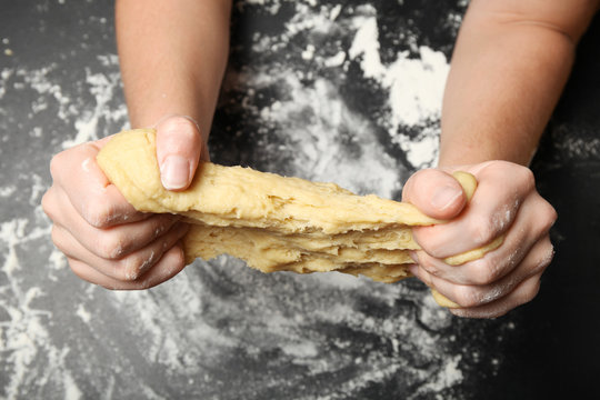 Prepare bread, kneading dough. Woman hands in flour, food cooking.