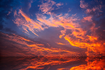 Obraz na płótnie Canvas Fiery orange sunset sky
