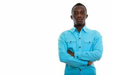 Studio shot of young black African man with arms crossed