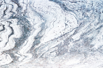 The plate is made of marble in black and white shades. Smooth texture for design and decoration. Natural building material. Natural patterns on the stone. Plates for floor and walls.