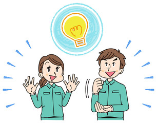 作業着を着た男女グループ ひらめき