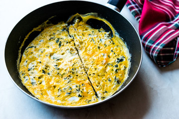 Half Cut Omelette with Cream Cheese and Chives in Pan.