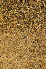 Small yellow stones on the road surface as background