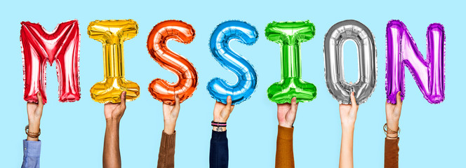 Colorful alphabet helium balloons forming the text mission