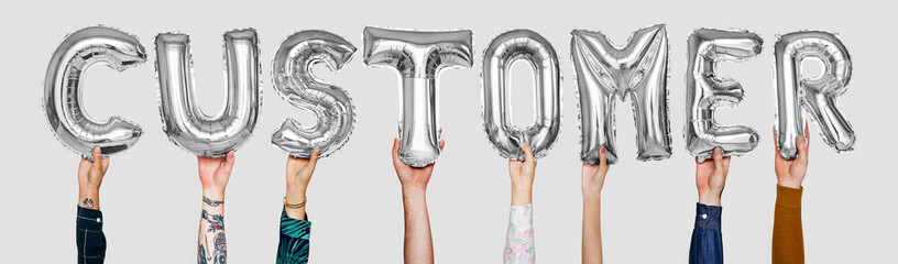 Silver gray alphabet balloons forming the word customer