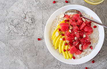 Delicious and healthy oatmeal with grapefruit, pomegranate, almond and chia seeds.  Healthy...