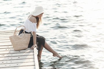 Happy woman on the beach.Portrait of a beautiful girl close-up.Spring portrait on the...