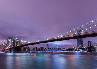 Brooklyn Bridge at sunset view. New York City, USA. Brooklyn Bridge is linking Lower Manhattan to Brooklyn..