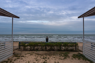 A girl is looking at the sea