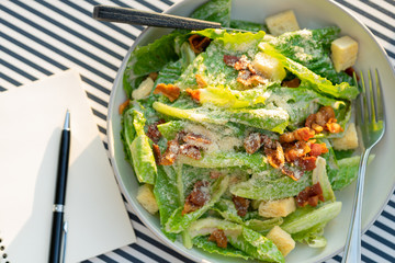 Salads are placed on the table with a notebook and a pen. To record food items or recipes Concept foodie Diet Food Review Weight Loss Diet