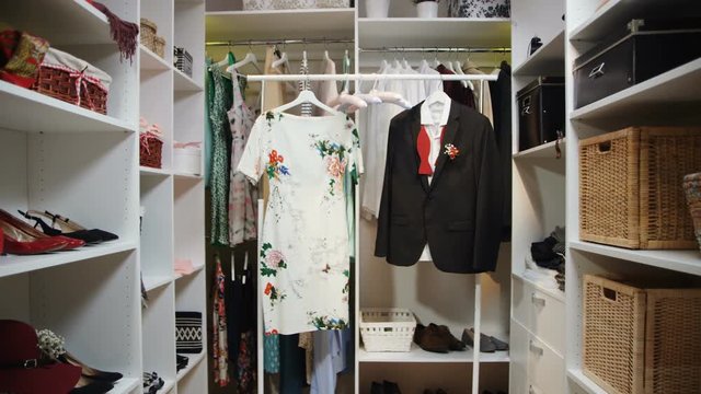 dress with floral print and jacket with bow-tie in wardrobe