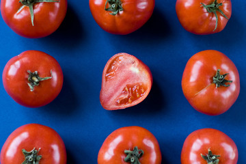 red tomatoes on a blue background in the shape of a square