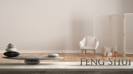Wooden vintage table shelf with stone balance and 3d letters making the word feng shui over white...