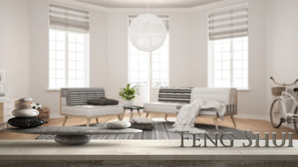 Wooden vintage table shelf with stone balance and 3d letters making the word feng shui over empty scandinavian living room, modern lounge, zen concept interior design