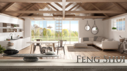 Wooden vintage table shelf with stone balance and 3d letters making the word feng shui over...
