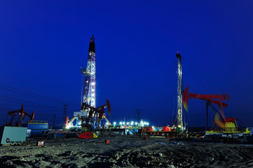 Oil drilling rig in the evening