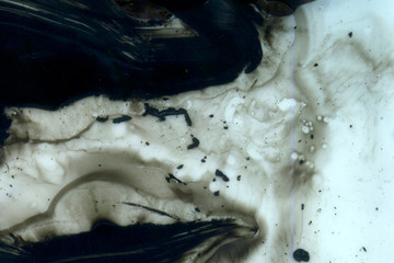 Abstract ink background. Marble style. Black paint stroke texture on white paper. Wallpaper for web and game design. Grunge mud art. Macro image of pen juice. Dark Smear.