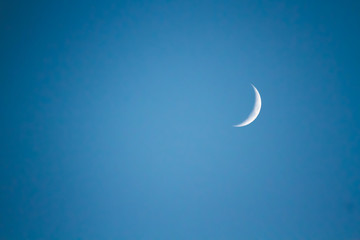 Obraz na płótnie Canvas Moon's Crescent Phase Against a Black Night Sky