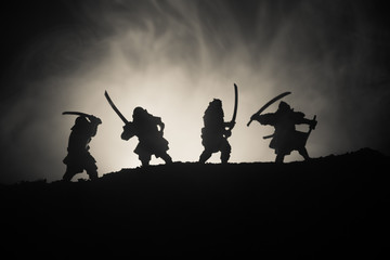 Silhouette of two samurais in duel. Picture with two samurais and sunset sky © zef art