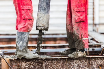 Construction men worker control boom concrete