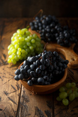 Fresh ripe grapes in the wooden bowl