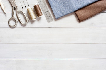 Sewing items on the light wooden table