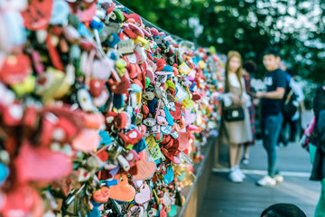 areity of locked key at N Seoul tower on the Namsan mountain that people believe they will have the forever love if write the couple name on it