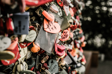 areity of locked key at N Seoul tower on the Namsan mountain that people believe they will have the forever love if write the couple name on it