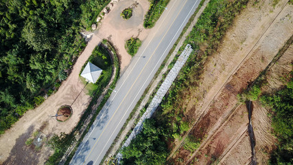 Obraz premium Aerial highway creek beneath transportation