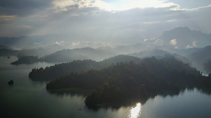 Aerial Khao Sok National Park with jungle and Clouds