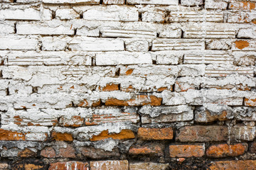 Old brick wall with white-red background and rough construction
