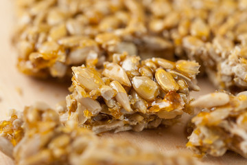 broken gozinaki from sunflower seeds on the Wooden board