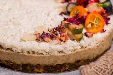 Cake close-up with strawberries, nuts, blueberries. Bright fruits and berries.