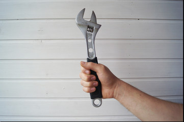 wrench in hand isolated on white background