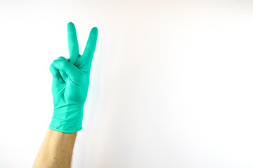 Male hand in medical glove on white background.