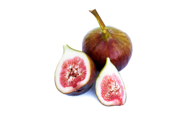 Whole and cut figs close-up isolated on white background