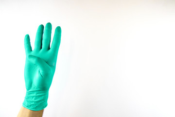Obraz premium Male hand in medical glove on white background.